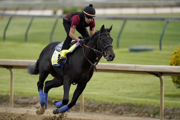 Kentucky Derby entrant Medina Spirit works out Churchill Downs Wednesday, April 28, 2021, in Louisville, Ky. The 147th running of the Kentucky Derby is scheduled for Saturday, May 1. (AP Photo/Charlie ...