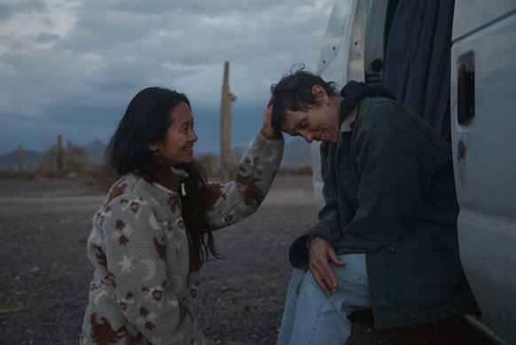 FILE - In this file photo, Director Chloe Zhao, left, appears with actress Frances McDormand on the set of &quot;Nomadland.&quot; ��Nomadland�� has won four prizes, including best picture, at the Brit ...