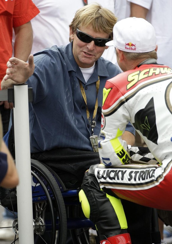U.S. Wayne Rainey, left, former World Champion motorcycle, speaks with U.S. Kevin Schwantz, right, former World Champion motorcycle, on track prior the Indianapolis Grand Prix on the Indianapolis Moto ...