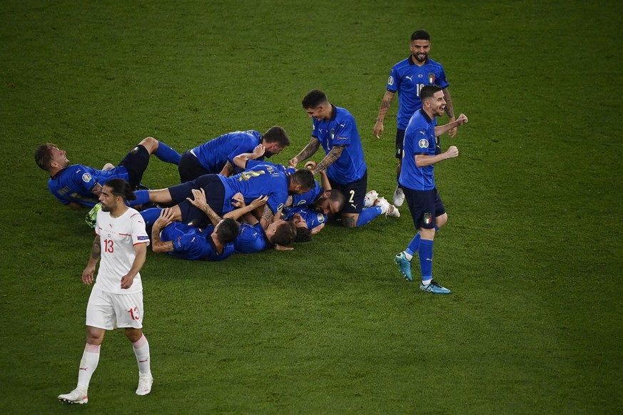 Italy&#039;s Manuel Locatelli celebrates with his teammates after scoring his side&#039;s second goal during the Euro 2020 soccer championship group A match between Italy and Switzerland at the Rome O ...