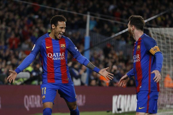 Barcelona&#039;s Neymar, left, celebrates with teammate Lionel Messi after scoring their side&#039;s second goal against Celta during a Spanish La Liga soccer match between Barcelona and Celta at the  ...