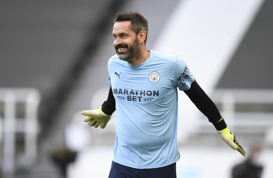 Manchester City&#039;s goalkeeper Scott Carson warms up prior to the English Premier League soccer match between Newcastle United and Manchester City at St James&#039; Park stadium, in Newcastle, Engl ...