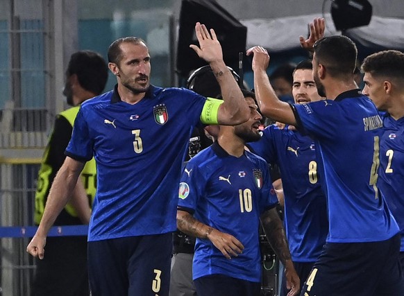 Italy&#039;s Giorgio Chiellini, left, celebrates after scoring a goal, which was later disallowed, during the Euro 2020 soccer championship group A match between Italy and Switzerland at Olympic stadi ...
