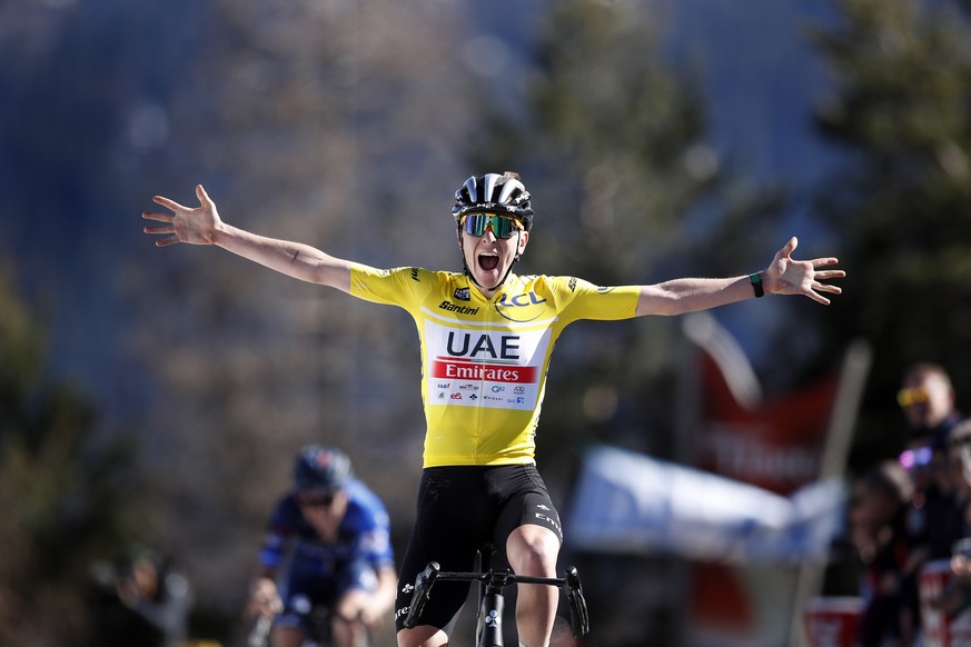 epa10515355 Slovenian rider Tadej Pogacar of UAE Team Emirates celebrates while crossing the finish line to win the seventh stage of the Paris-Nice cycling race over 142,80km from Nice to Col de la Co ...