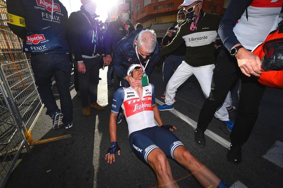 epa09086345 Belgian rider Jasper Stuyven (C) of the Trek - Segafredo team reacts after winning the one-day classic cycling race Milan-Sanremo in Sanremo, Italy, 20 March 2021. EPA/Luca Bettini