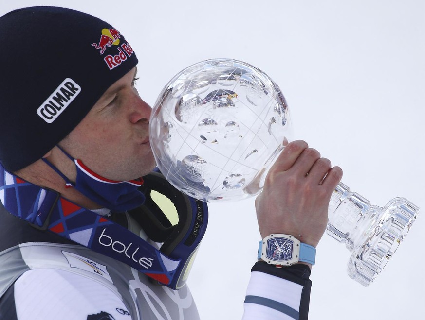France&#039;s Alexis Pinturault celebrates as he kisses the crystal ball trophy of the alpine ski, World Cup men&#039;s giant slalom discipline title, in Lenzerheide, Switzerland, Saturday, March 20,  ...
