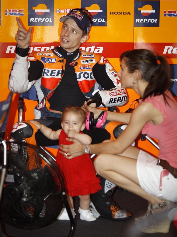 Australia&#039;s Casey Stoner chats with his family before the MotoGP free practice session at the Malaysian Motorcycle Grand Prix in Sepang, Malaysia, Friday, Oct. 19, 2012. (AP Photo/ Vincent Thian)