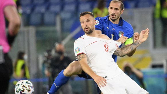 Switzerland&#039;s forward Haris Seferovic, left, in action against Italy&#039;s defender Giorgio Chiellini, right, during the Euro 2020 soccer tournament group A match between Italy and Switzerland a ...