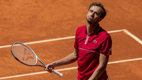 Russia&#039;s Daniil Medvedev reacts after missing a point against Cristian Garin of Chile during their match at the Mutua Madrid Open tennis tournament in Madrid, Spain, Thursday, May 6, 2021. (AP Ph ...