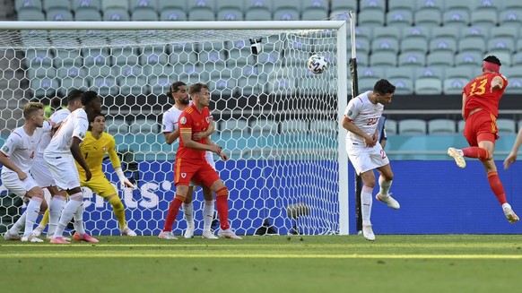 Wales&#039; Kieffer Moore, right, scores his team&#039;s first goal during the Euro 2020 soccer championship group A match between Wales and Switzerland at Baku Olympic Stadium in Baku, Azerbaijan, Sa ...