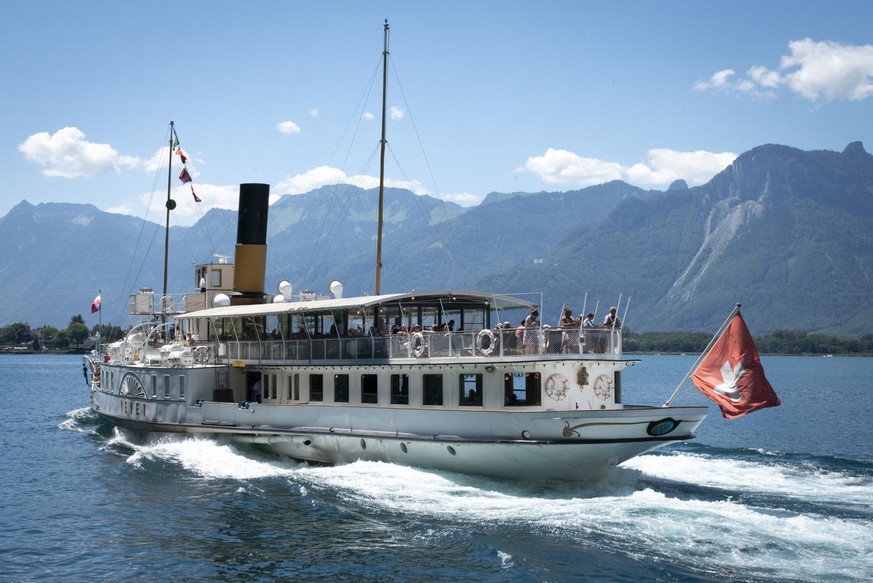 The steamboat Vevey, CGN, sails on the Lake Geneva close to the Chillon Castle (Chateau de Chillon) during the coronavirus disease (COVID-19) outbreak, in Veytaux near Montreux, Switzerland, Sunday, J ...