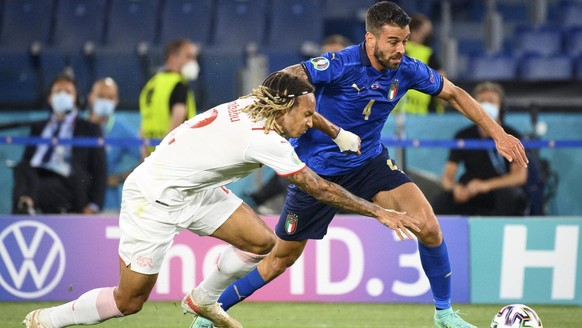 Switzerland&#039;s defender Kevin Mbabu, left, in action against Italy&#039;s defender Leonardo Spinazzola, right, during the Euro 2020 soccer tournament group A match between Italy and Switzerland at ...