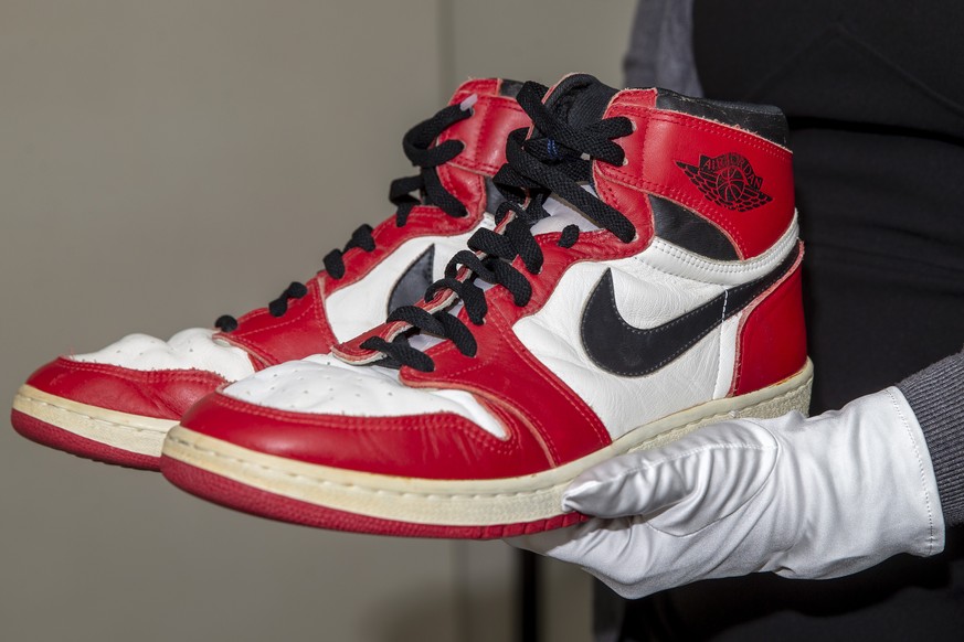 A person shows shoes of former NBA player Michael Jordan Game Worn 1985 Player Sample Air Jordan 1s estimated to sell between 100&#039;000 - 150&#039;000 CHF, during a preview at the Sotheby&#039;s pr ...