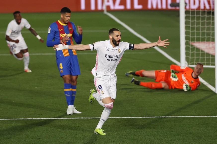 epa09127716 Real Madrid&#039;s Karim Benzema celebrates after scoring the 1-0 lead during the Spanish LaLiga soccer match between Real Madrid and FC Barcelona at Alfredo di Stefano stadium in Madrid,  ...