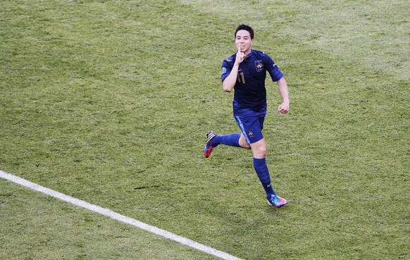 epa03259863 French Samir Nasri celebrates after scoring the 1-1 equalizer during the Group D preliminary round match of the UEFA EURO 2012 between France and England in Donetsk, Ukraine, 11 June 2012. ...