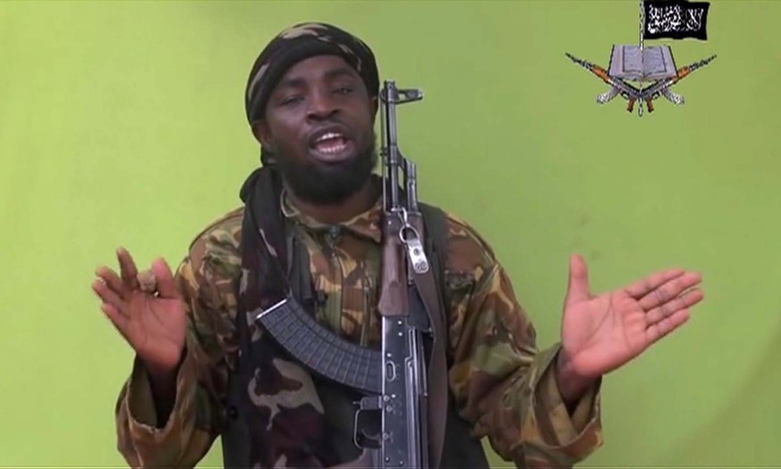 In this photo taken from video by Nigeria&#039;s Boko Haram terrorist network, Monday May 12, 2014 shows their leader Abubakar Shekau speaking to the camera. The new video purports to show dozens of a ...
