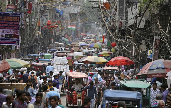 Indians crowd a market place in New Delhi, India, Wednesday, July 11, 2018. India&#039;s population tops 1.2 billion making it the second most populous country in the world after China. Wednesday mark ...