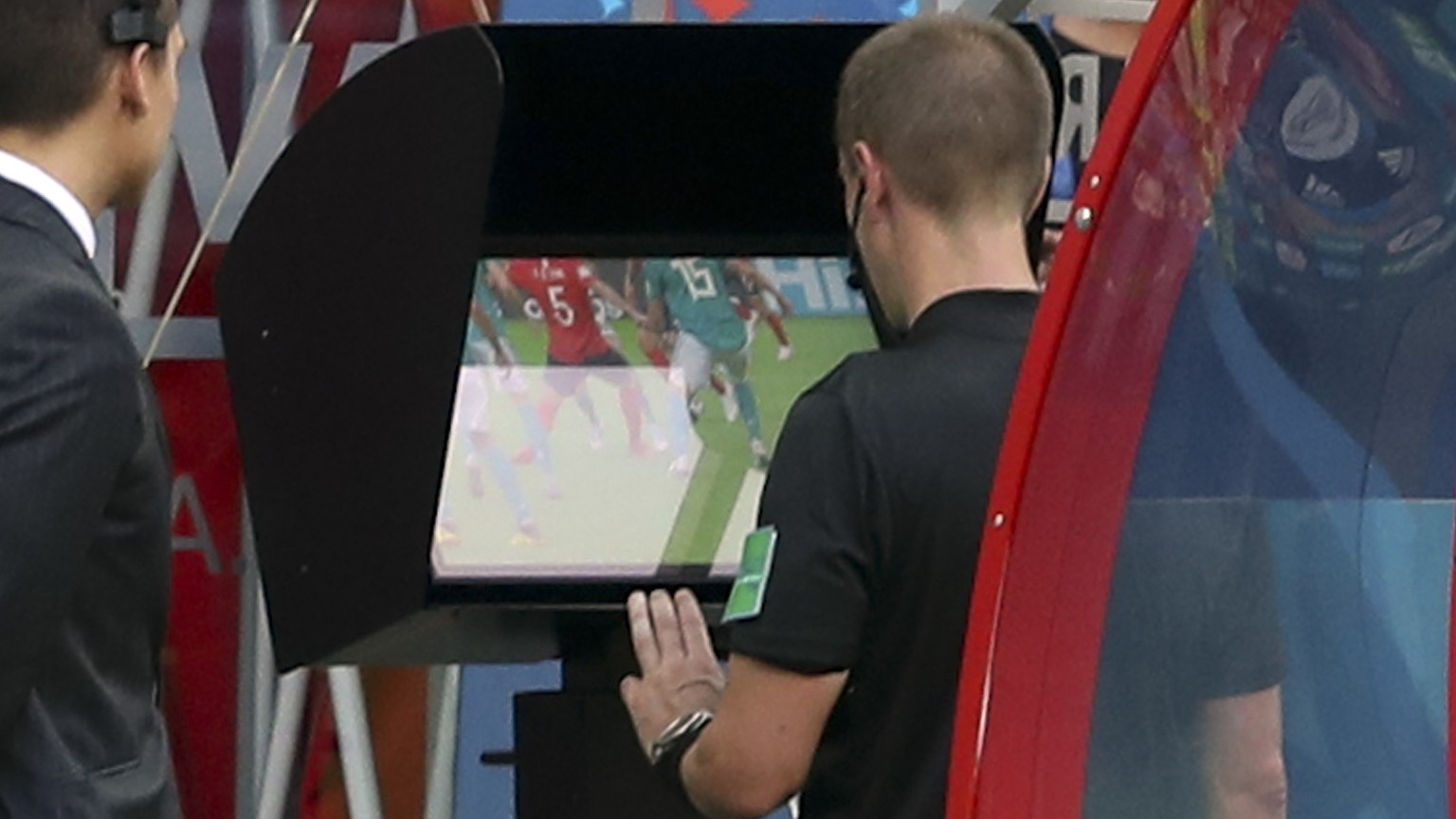 Referee Mark Geiger from the US watches the Video Assistant Referee system, known as VAR, during the group F match between South Korea and Germany, at the 2018 soccer World Cup in the Kazan Arena in K ...