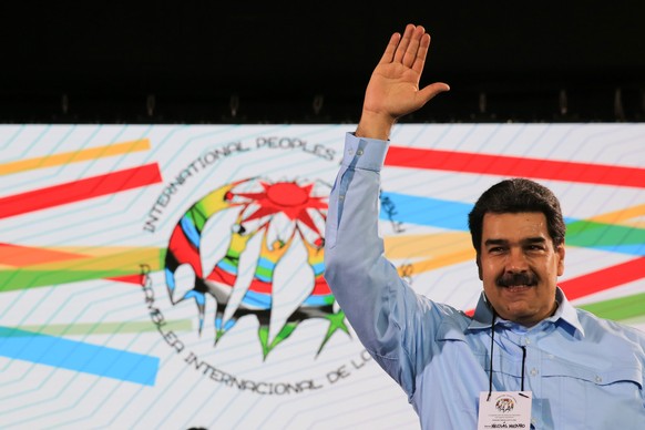 epa07399957 A handout picture provided by Miraflores press shows the Venezuelan President Nicolas Maduro during his participation during the closure of the International People&#039;s Assembly in Cara ...