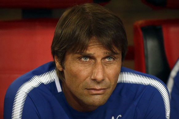 Chelsea&#039;s manager Antonio Conte watches the pregame ceremonies before the start of his team&#039;s friendly soccer match against Arsenal in Beijing, Saturday, July 22, 2017. Chelsea beat Arsenal, ...