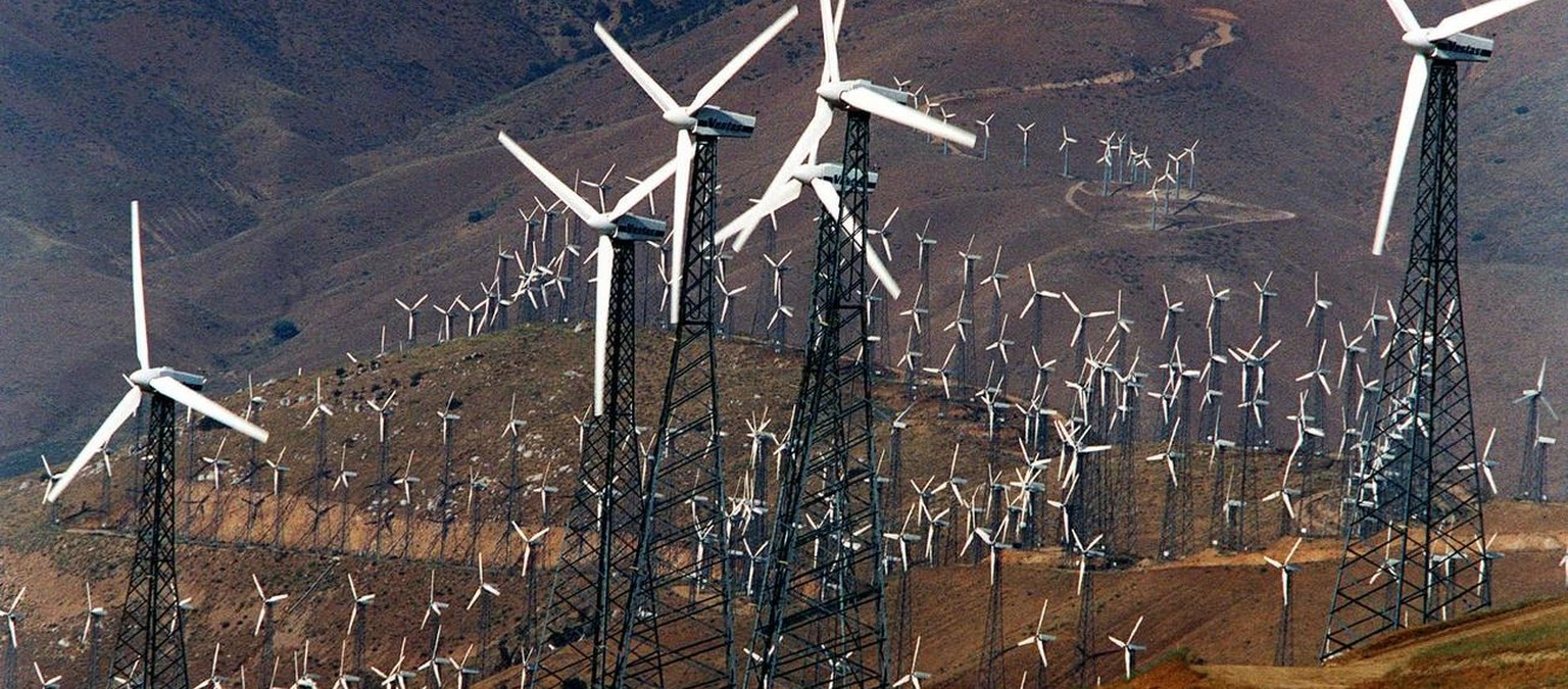 Windmills twirl on the hills above Mojave, Calif., July 20, 1998. California is the birthplace of wind power in the United States, and it is the first state to let consumers choose the source of their ...
