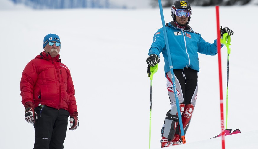Marcel Hirscher of Austria, right, reacts next to his father Ferdinand Hirscher, left, in action during the second run of the menÕs slalom race of the FIS Alpine Ski World Cup at the Lauberhorn, in We ...