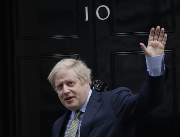 Britain&#039;s Prime Minister Boris Johnson returns to 10 Downing Street after meeting with Queen Elizabeth II at Buckingham Palace, London, on Friday, Dec. 13, 2019. Prime Minister Boris Johnson&#039 ...
