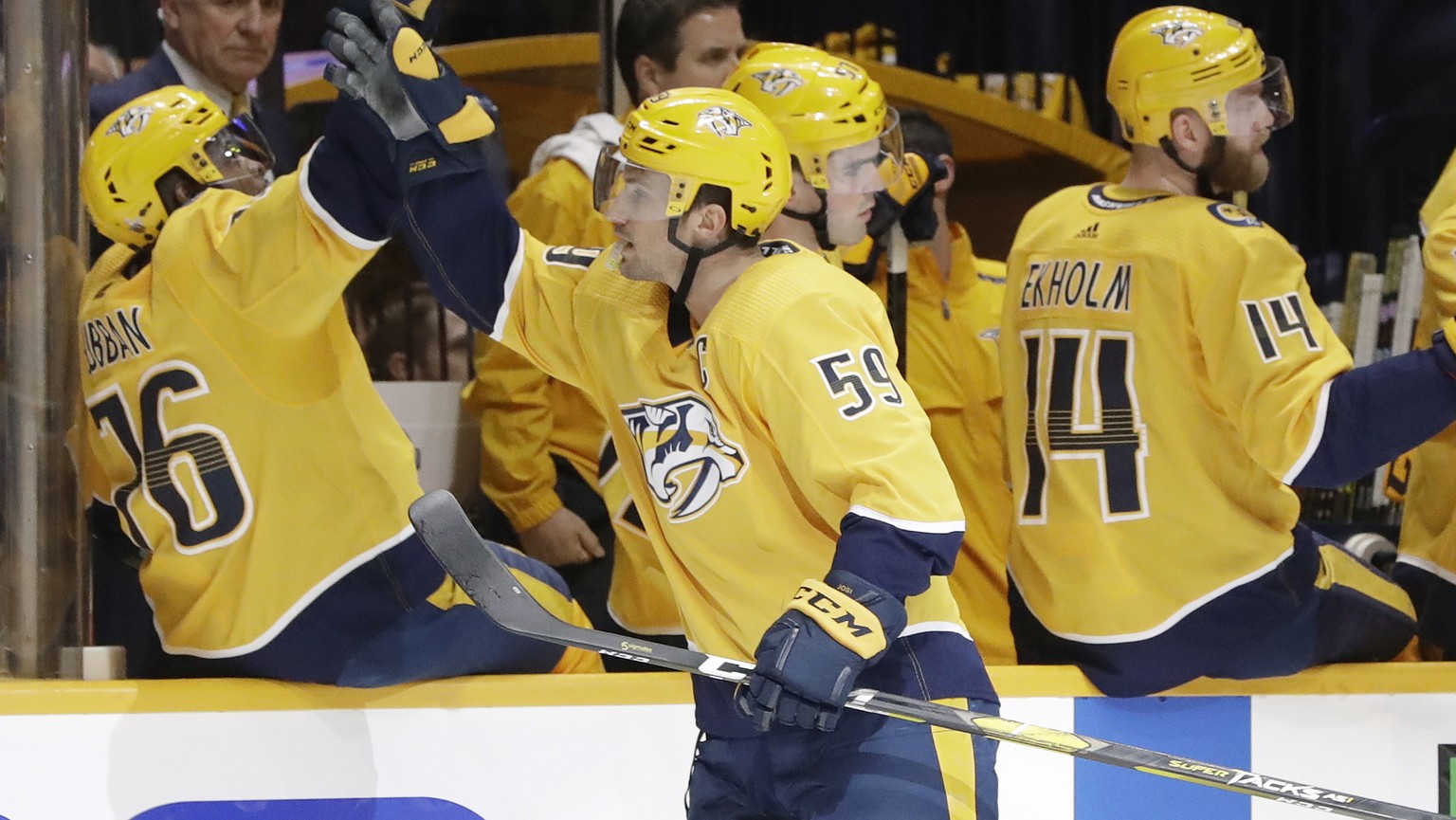 Nashville Predators defenseman Roman Josi (59), of Switzerland, celebrates with P.K. Subban (76) after Josi scored a goal against the Dallas Stars during the first period in Game 1 of an NHL hockey fi ...