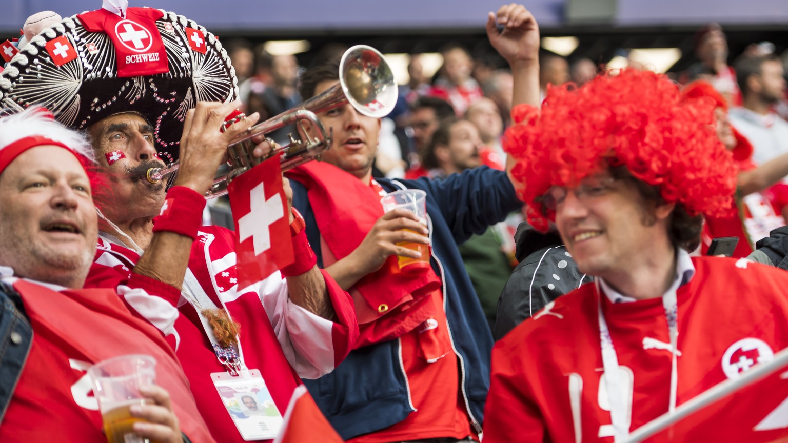 Fans from Switzerland cheer during the FIFA World Cup 2018 group E preliminary round soccer match between Switzerland and Serbia at the Arena Baltika Stadium, in Kaliningrad, Russia, Friday, June 22,  ...