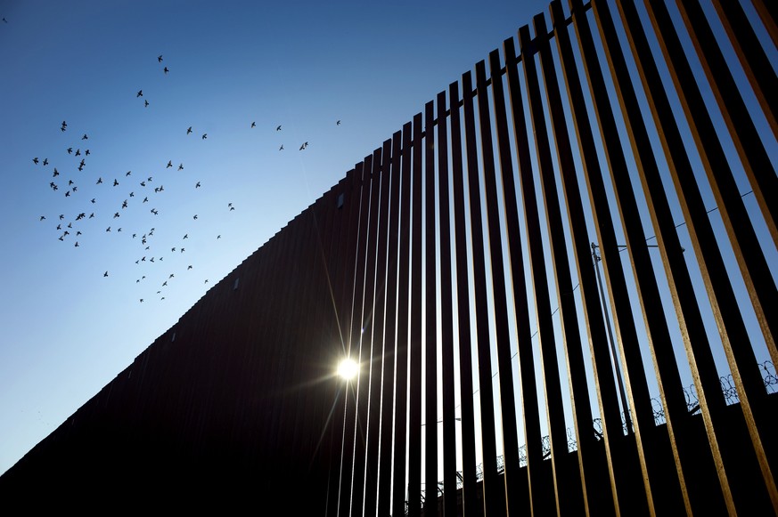 epa07743520 (FILE) - Birds fly over a section of the recently renovated US-Mexico border wall, in Calexico, California, USA, on 26 October 2018, (reissued 27 July 2019). According to media reports on  ...