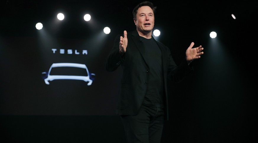 FILE- In this March 14, 2019, file photo Tesla CEO Elon Musk speaks before unveiling the Model Y at Tesla&#039;s design studio in Hawthorne, Calif. Shares of electric vehicle maker Tesla Inc. fell at  ...