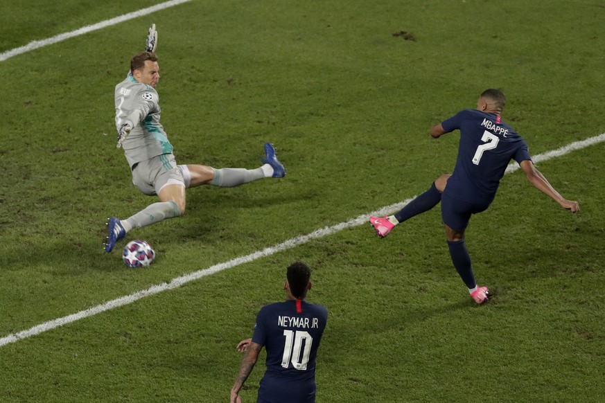 Bayern&#039;s goalkeeper Manuel Neuer saves a shot by PSG&#039;s Kylian Mbappe during the Champions League final soccer match between Paris Saint-Germain and Bayern Munich at the Luz stadium in Lisbon ...