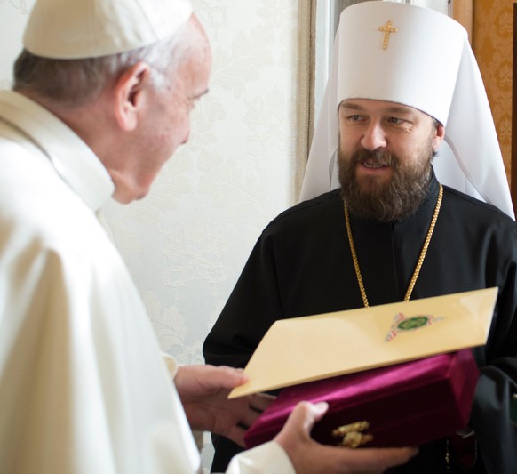 Pope Francis exchanges gifts with Hilarion Alfeyev , Metropolitan of Volokolamsk, at the Vatican Saturday, Dec. 10, 2016. (L&#039;Osservatore Romano/Pool Photo via AP)