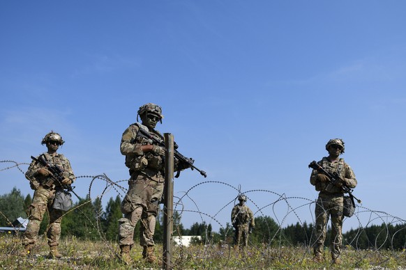 epa08595110 Soldiers of the 173rd Airborne Brigade patrol at the US Army?s Joint Multinational Readiness Center in Hohenfels, Germany, 10 August 2020. Forces from Albania, Georgia, Latvia, Lithuania,  ...