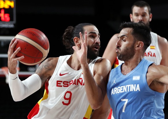 epa09376895 Ricky Rubio (L) of Spain in action against Facundo Campazzo (R) of Argentina during the Men&#039;s preliminary round Group C match between Spain and Argentina during the Basketball events  ...