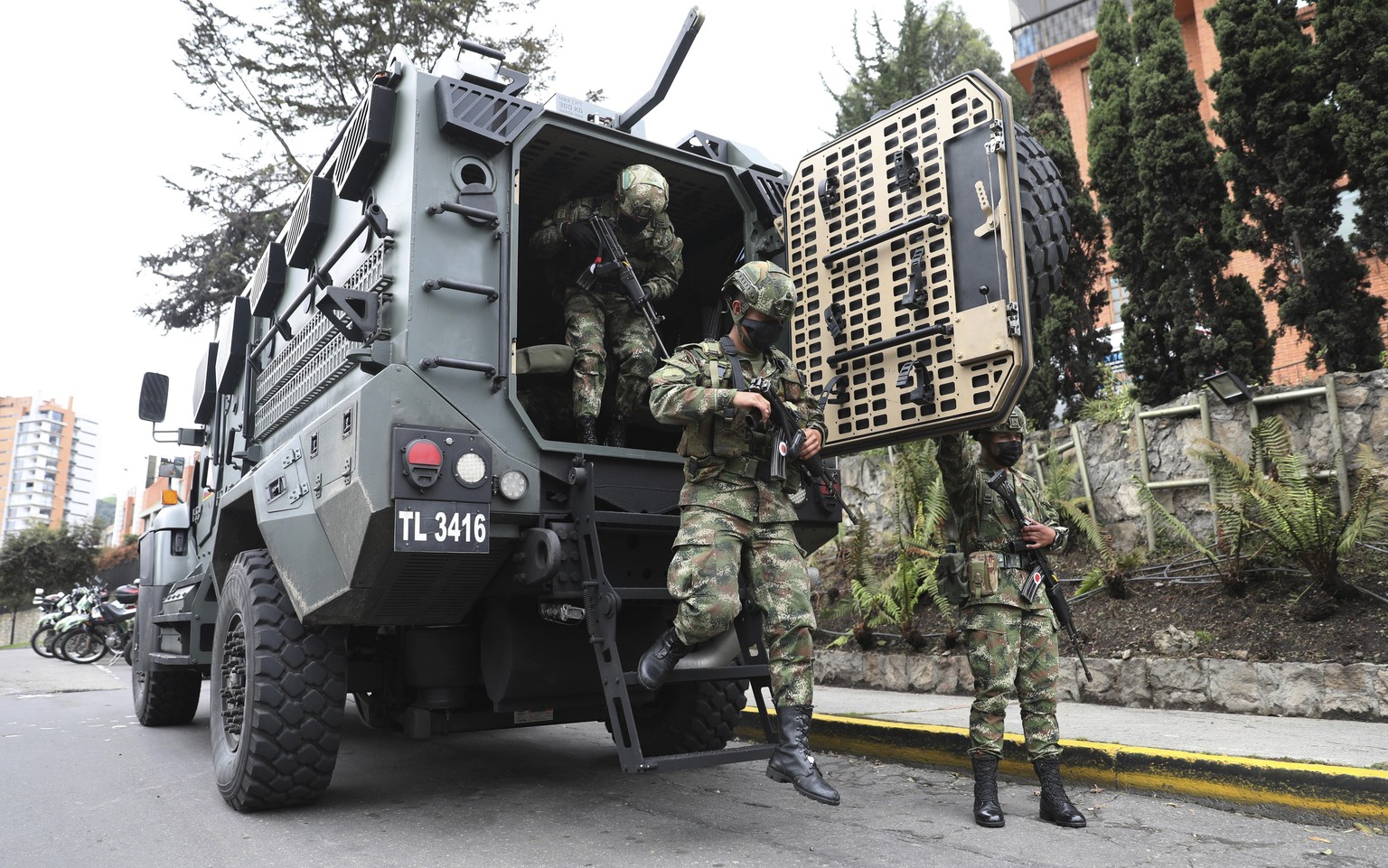 Soldiers exit an armored vehicle during a national strike against tax reform in Bogota, Colombia, Monday, May 3, 2021. Colombia&#039;s President Ivan Duque withdrew the government-proposed tax reform  ...