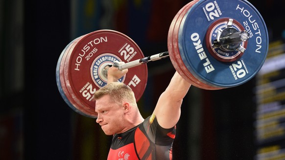 epa05043559 Bernard Tomasz Zielinski of Poland completes a lift in the Snatch during the mens 94kg, 207lb weight class A at the George R. Brown Convention Center in Houston, Texas, USA, 26 November 20 ...