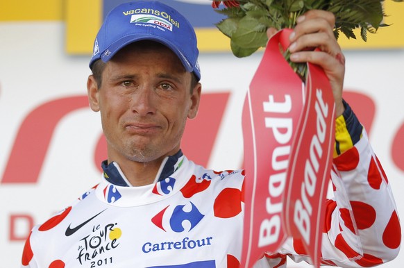 Johnny Hoogerland of The Netherlands, wearing the best climber&#039;s dotted jersey, cries on the podium of the 9th stage of the Tour de France cycling race over 208 kilometers (129 miles) starting in ...