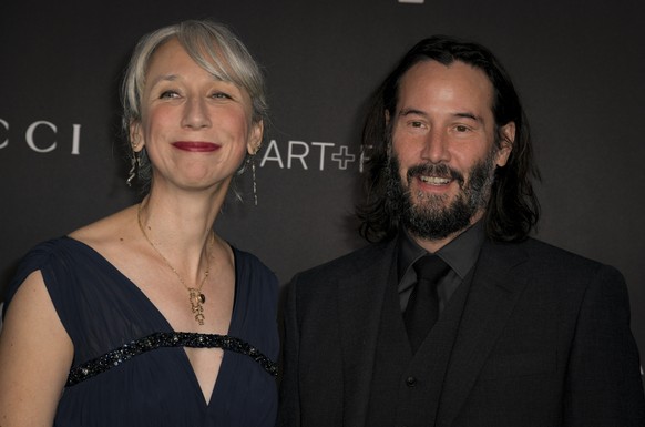 epa07968809 US actor Keanu Reeves (R) and his girlfriend, Alexandra Grant (L), pose upon their arrival at the 2019 LACMA Art + Film Gala at the Los Angeles County Museum of Art in Los Angeles, Califor ...