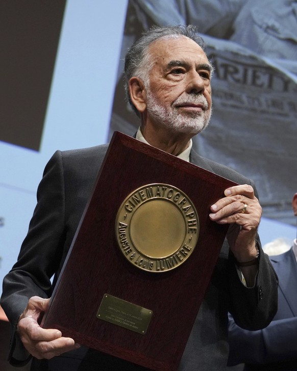 US director Francis Ford Coppola holds his award during the Lumiere Award ceremony of the 11th Lumiere Festival, in Lyon, central France, Friday, Oct. 18, 2019. (AP Photo/Laurent Cipriani)