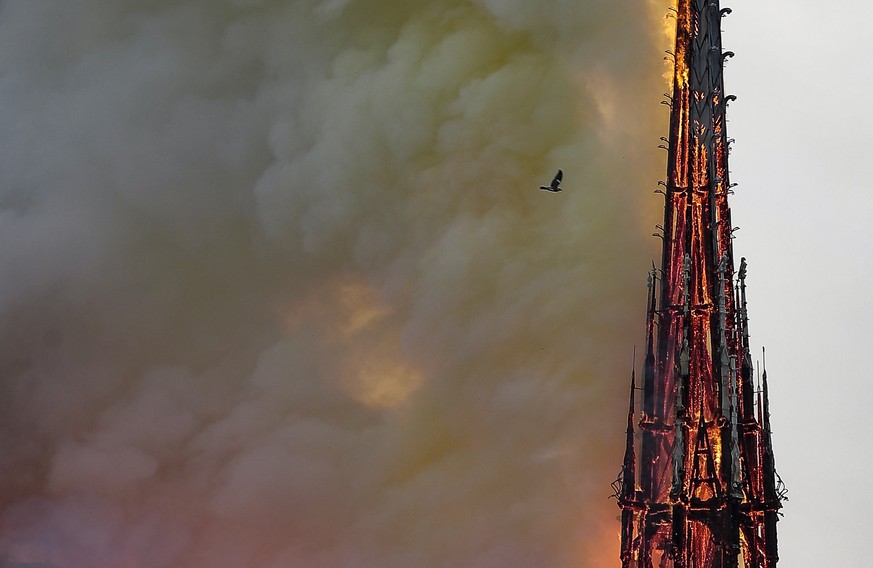 epa07510183 Flames on the roof of the Notre-Dame Cathedral in Paris, France, 15 April 2019 (issued 16 April 2019). A raging fire that tore through Notre-Dame Cathedral in central Paris was extinguishe ...