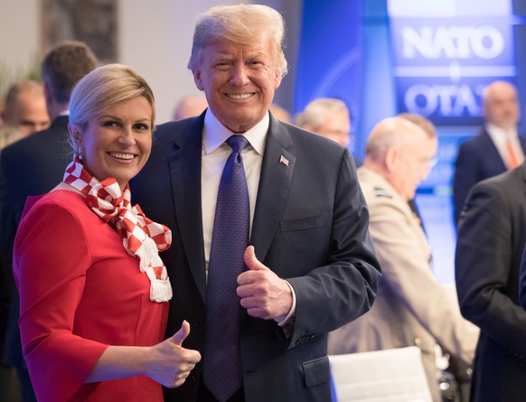 epa06881473 US President Donald J. Trump and Croatian President Kolinda Grabar-Kitarovic (L) at a dinner at the Art and History Museum at the Park Cinquantenaire during a NATO Summit in Brussels, Belg ...