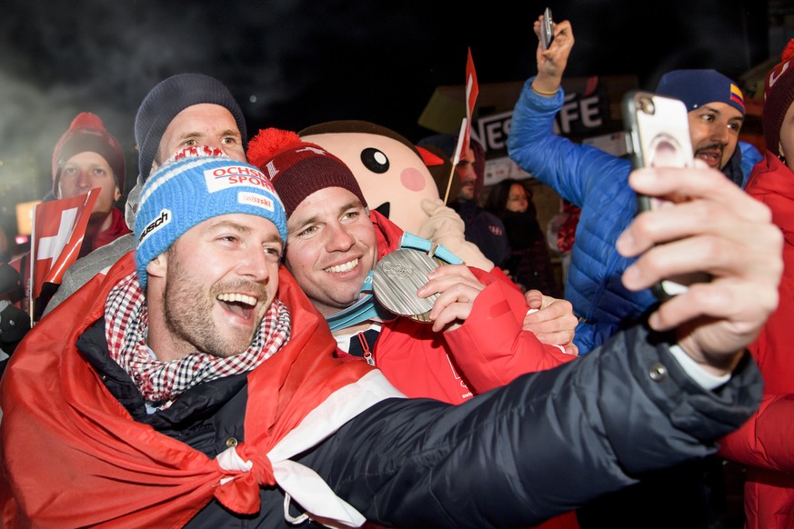 Silver and Bronze medals, Beat Feuz of Switzerland, celebrates at the House of Switzerland after the men Alpine Skiing Super G race and one dav after the men Alpine Skiing downhill race during the XXI ...