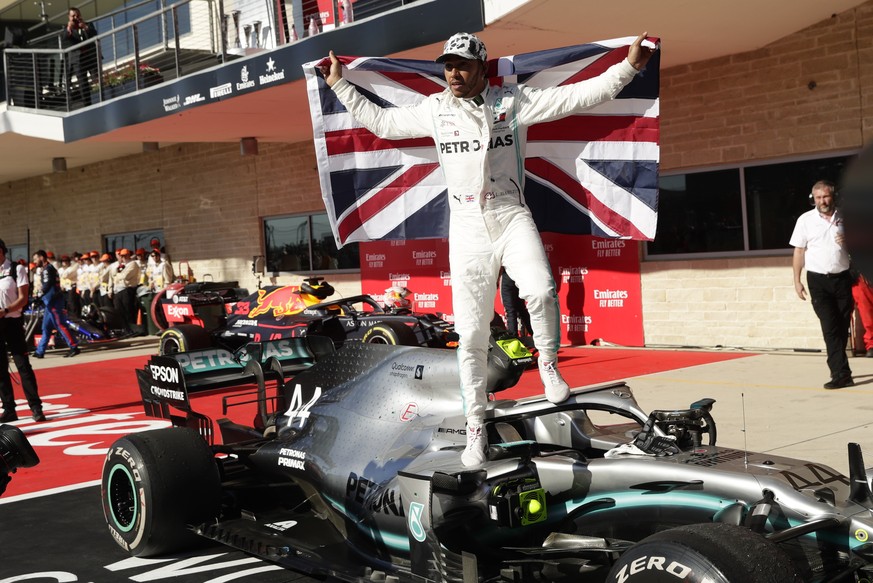 Mercedes driver Lewis Hamilton, of Britain, celebrates after the Formula One U.S. Grand Prix auto race at the Circuit of the Americas, Sunday, Nov. 3, 2019, in Austin, Texas. (AP Photo/Eric Gay)