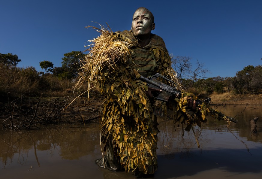 In this image released by the World Press Photo Foundation Thursday April 11, 2019, titled &quot;Akashinga - the Brave Ones&quot; by Brent Stirton, Getty Images, which was awarded first prize in the E ...