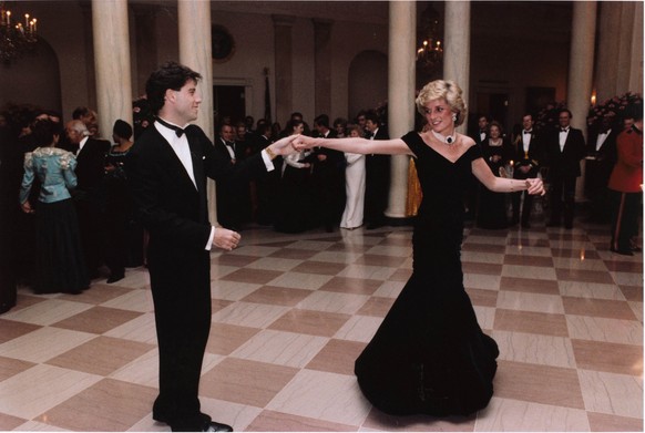 FILE - In this Nov. 9, 1985 photo provided by the Ronald Reagan Library, actor John Travolta dances with Princess Diana at a White House dinner in Washington. Since strutting onto the big screen in “S ...