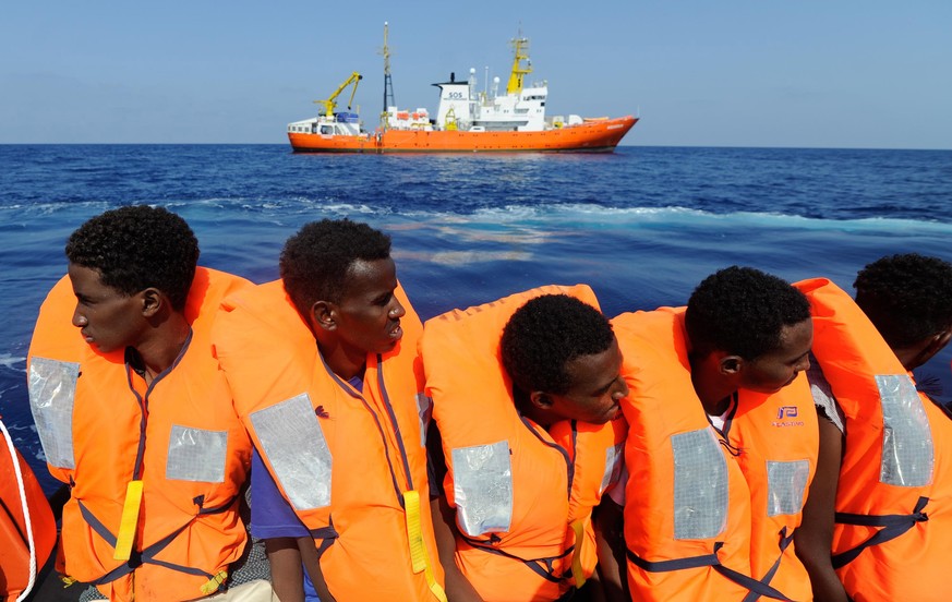 epa06947858 A handout photo made available by SOS Mediterranee on 13 August 2018 shows migrants being rescued by the NGO&#039;s rescue ship &#039;Aquarius&#039; in the Mediterranean, 10 August 2018. T ...