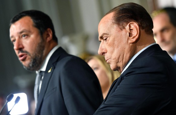 Forza Italia party&#039;s Leader Silvio Berlusconi, right, listens to The League party&#039;s leader Matteo Salvin as he speaks with journalists at the Quirinale presidential palace after talks with I ...