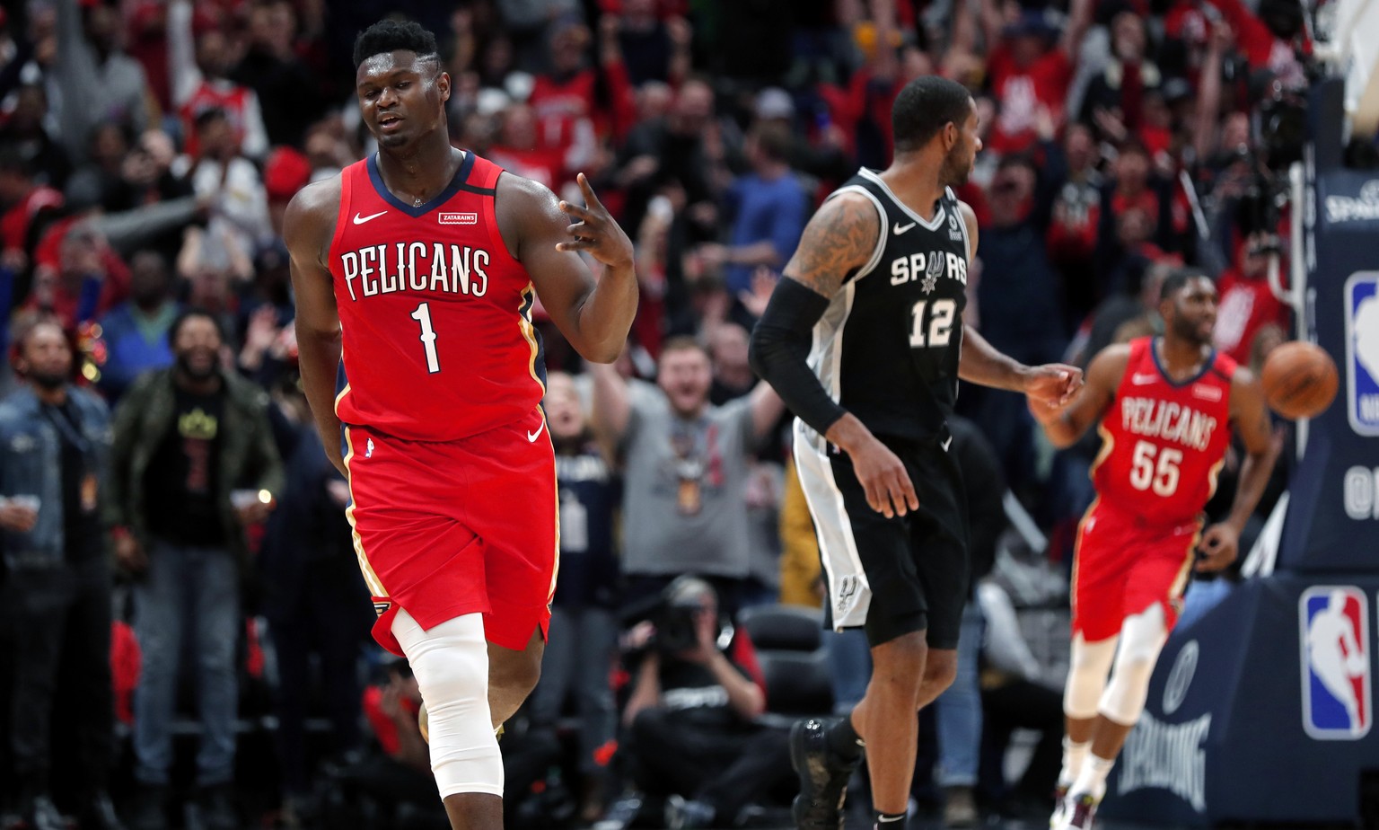 New Orleans Pelicans forward Zion Williamson (1) reacts after making a 3-point basket in the second half of an NBA basketball game against the San Antonio Spurs in New Orleans, Wednesday, Jan. 22, 202 ...