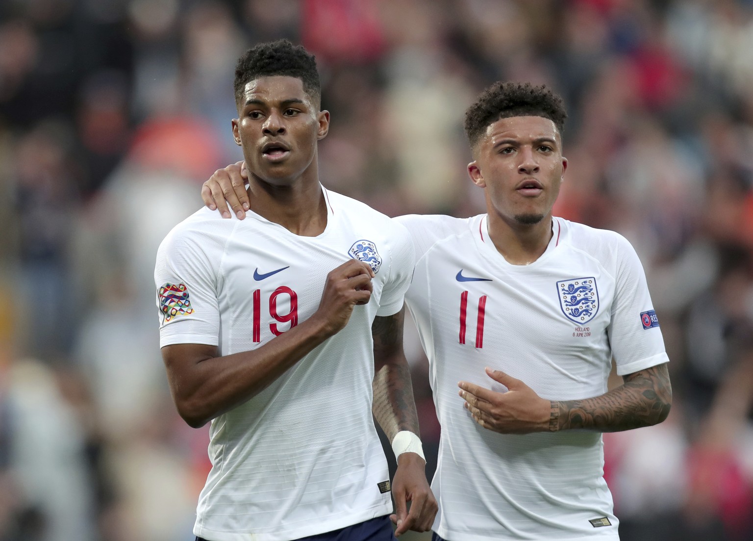England&#039;s Marcus Rashford, left, celebrates with England&#039;s Jadon Sancho after scoring his side&#039;s opening goal from the penalty spot during the UEFA Nations League semifinal soccer match ...